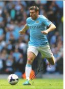 Football James Milner 12x8 signed colour photo pictured in action for Manchester City. Good