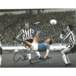 Football Dennis Tueart 10x8 signed colour enhanced photo pictured in action for Manchester City.