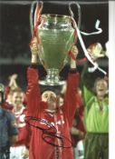 Football Ryan Giggs 12x8 signed colour photo pictured lifting the champions league trophy while at