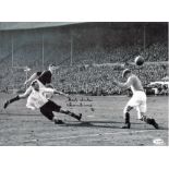 Football Tom Finney signed 16x12 black and white photo pictured in action for England. Good