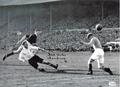 Football Tom Finney signed 16x12 black and white photo pictured in action for England. Good