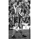 Football Bobby Moncur signed 16x12 black and white photo pictured in action for Newcastle United.