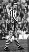 Football Bobby Moncur signed 16x12 black and white photo pictured in action for Newcastle United.