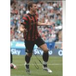Football Edin Dzeko 12x8 signed colour photo pictured celebrating while playing for Manchester City.