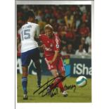 Football Dirk Kuyt 12x8 signed colour photo pictured in action for Liverpool. Good Condition. All