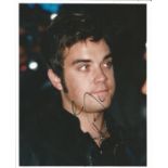 Robbie Williams signed young 10 x 8 inch colour portrait photo, signed to darker area, priced