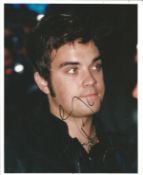 Robbie Williams signed young 10 x 8 inch colour portrait photo, signed to darker area, priced