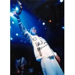Ian Brown signed colour 16 x 12 inch photo on stage. Good Condition. All signed pieces come with a