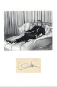 Marlene Dietrich signature piece mounted below black and white photo. Approx overall size 16x14,