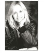 Susan George signed 10 x 8 inch b/w portrait photo. Good Condition. All signed pieces come with a