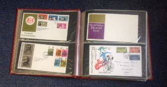 GB FDC collection in Red Album. 120+ covers mainly FDCs with some Air Letters, commemorative covers.