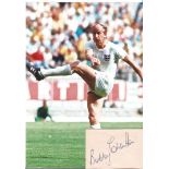 Bobby Charlton Signed Card With England Photo. Good Condition. All signed pieces come with a