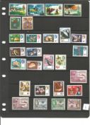 Collection of 50+ stamps BCW mint and used George Vi and QEII Includes Fiji and Gambia Ceylon