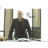 James Bond Judi Dench as M signed 10 x 8 inch colour photo standing behind her desk. Good Condition.