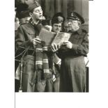 Dads Army Ian Lavender as Private Pike signed 10 x 8 inch b/w photo singing with Arthur Lowe. Good