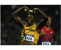 Usain Bolt Athletics Signed 10 x 8 inch sport photo. Good Condition. All signed pieces come with a