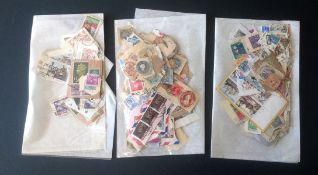 Assorted used stamp collection on backing paper. 3 bags, includes stamps from BCW, Foreign and GB.