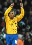 Robinho Brazil Signed 16 x 12 inch football photo. Good Condition. All signed pieces come with a