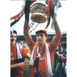 Norman Whiteside Man United Signed 16 x 12 inch football photo. Good Condition. All signed pieces