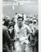 Freddie Truman. 8x10 photo signed by the late Fred Trueman, pictured leaving the field after
