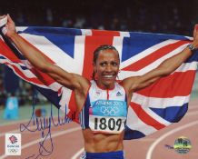 Dame Kelly Holmes. Stunning 8x10 inch photo hand signed by Dame Kelly Holmes. This is an official