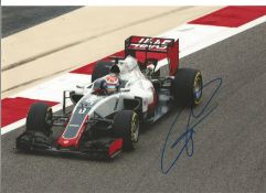 Romain Grosjean signed 12x8 colour in action photo. Good Condition. All signed pieces come with a