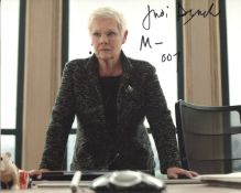 007 James Bond. 8x10 photo signed by Dame Judi Dench as M. Unusually, she had added this to her