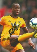 Football Willy Boly signed 12x8 colour photo pictured playing for Wolves. Good Condition. All signed