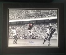 Football Bryan Robson signed 20x16 mounted colour enhanced photo pictured scoring for England