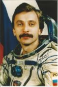 Cosmonaut Aleksandr Lazutkin signed 6 x 4 inch colour photo. Soyuz Tm25 Mir. Good conditon. We