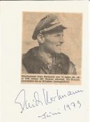 Erich Hartmann all-time top fighter ace signed white paper with small newspaper photo fixed on to it