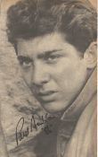 Paul Anka signed black and white newspaper photo. Good Condition. All autographs are genuine hand