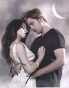 New Moon signed 10x8 dual signed colour photo. Good Condition. All autographs are genuine hand
