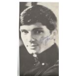 Gene Pitney signed black and white newspaper photo. Good Condition. All autographs are genuine