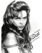 Brigitte Bardot signed sexy 10 x 8 inch b/w photo. Condition 9/10. All autographs are genuine hand