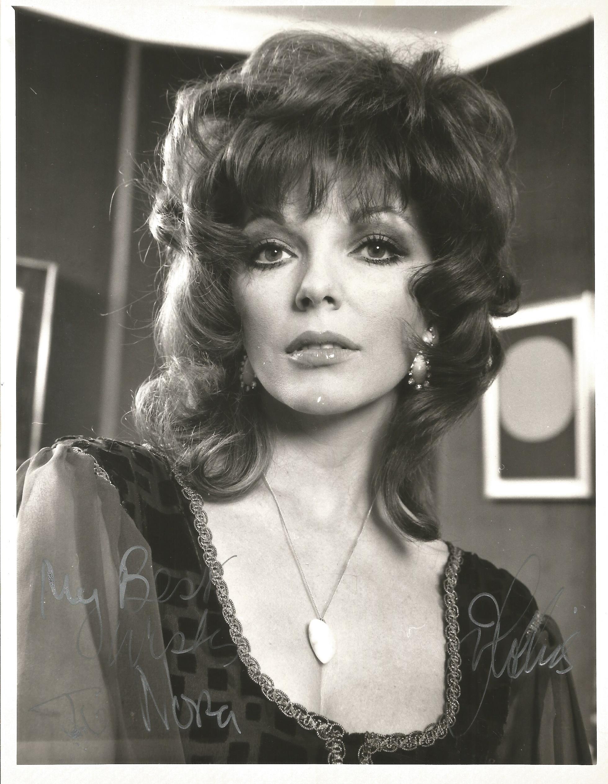 Joan Collins Signed 8 x 6 inch b/w portrait photo, to Nora. Condition 6/10. All autographs are