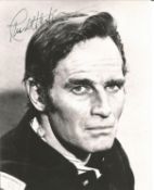 Charlton Heston Signed 10 x 8 inch b/w photo, in Western outfit, slight crease on forehead.