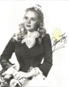 Alice Faye Signed 10 x 8 inch vintage b/w photo, yellow spot above autograph, still bold.