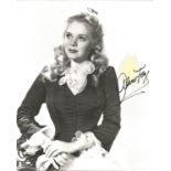 Alice Faye Signed 10 x 8 inch vintage b/w photo, yellow spot above autograph, still bold.