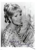 Debbie Reynolds Signed 6 x 4 inch b/w photo. Condition 8/10. All autographs are genuine hand