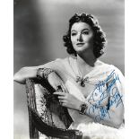 Myrna Loy Signed 10 x 8 inch b/w photo to Nora, slight mark at top. Condition 7/10. All autographs