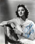 Myrna Loy Signed 10 x 8 inch b/w photo to Nora, slight mark at top. Condition 7/10. All autographs