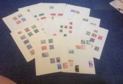 Assorted stamp collection on 12 loose album pages, Includes Dominica, Falkland Islands and Malta,