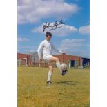 JOHN GILES football autographed 12 x 8 photo, a superb image depicting the Leeds midfielder striking
