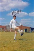 JOHN GILES football autographed 12 x 8 photo, a superb image depicting the Leeds midfielder striking