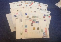 Assorted stamp collection on 14 loose album pages, Includes stamps from Yugoslavia, Ukraine, Latvia,