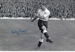 JOHNNY BROOKS football autographed 12 x 8 photo, a superb image depicting Brooks striking an