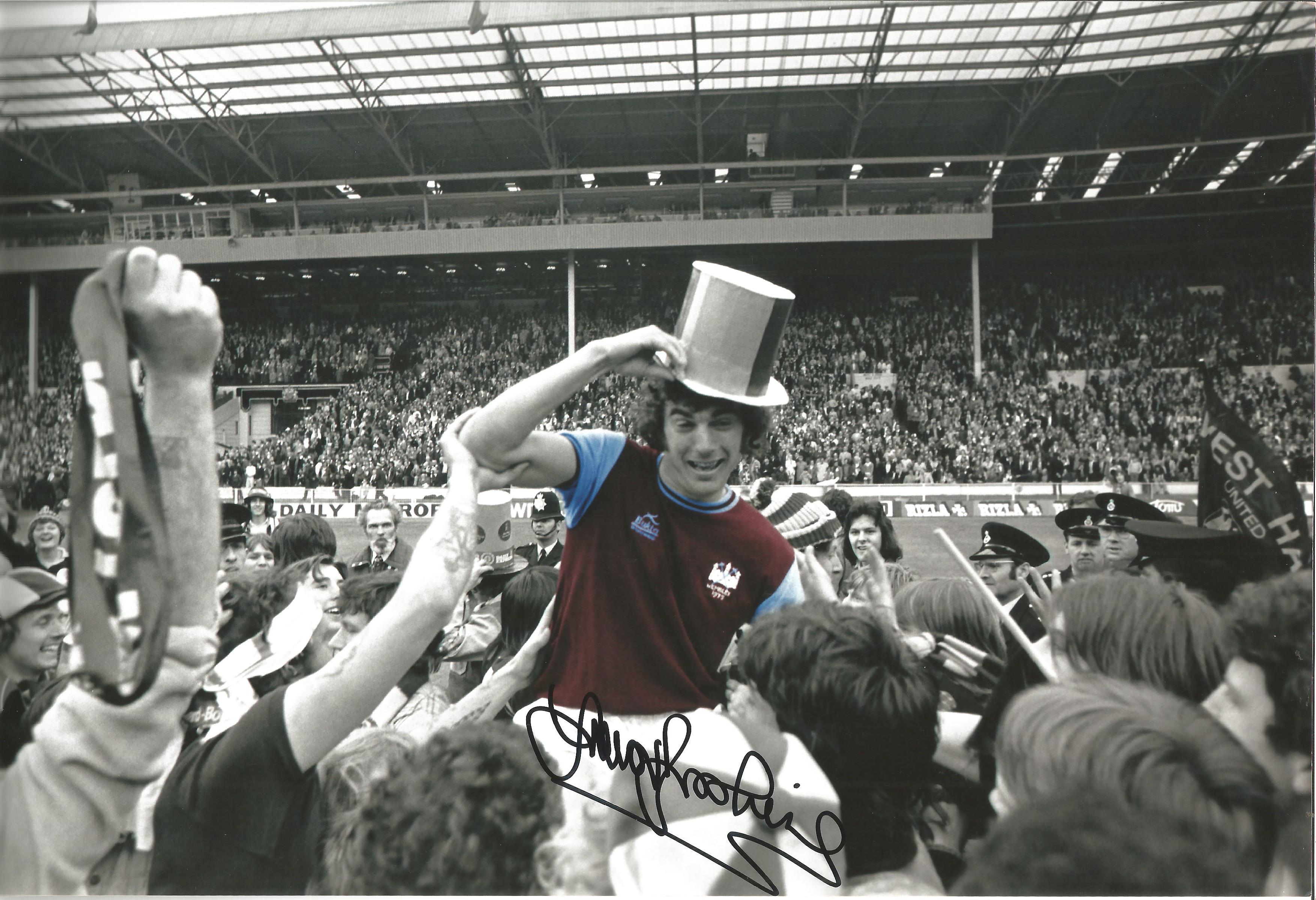 Trevor Brooking West Ham Signed 12 x 8 inch colour enhanced football photo. . All autographs are