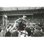 Trevor Brooking West Ham Signed 12 x 8 inch colour enhanced football photo. . All autographs are