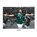 Gareth McCauley Northern Ireland Signed 16 x 12 inch football photo. . All autographs are genuine